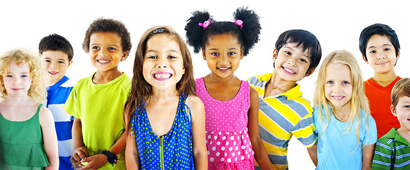 A colorful group of children and adults posing together for a photo.