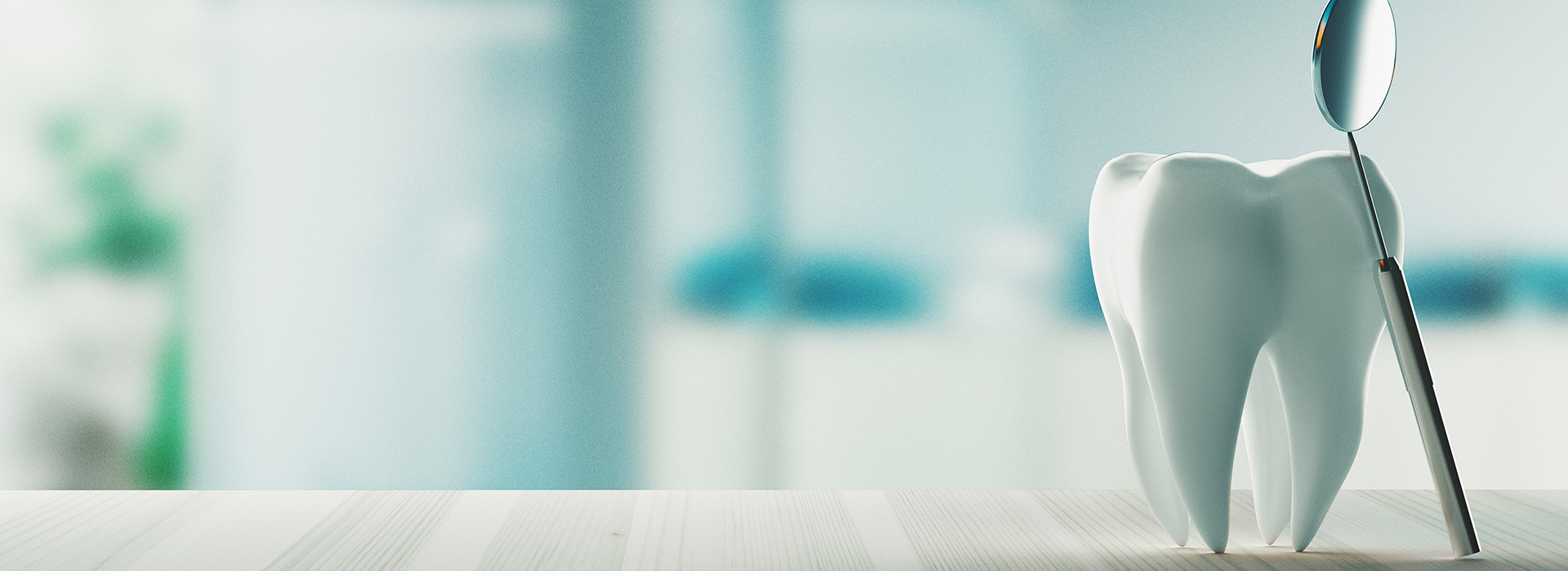 A close-up of a dental implant in a mouth with a blurred background.